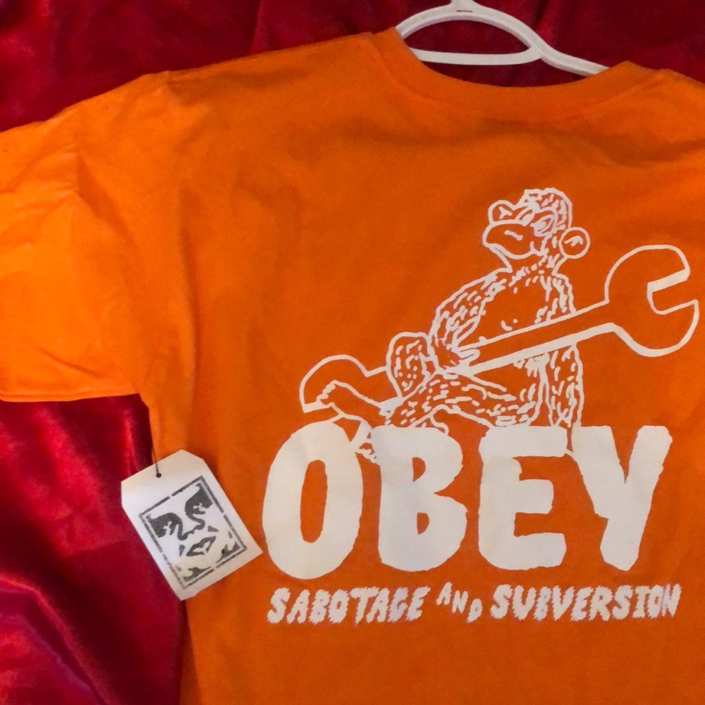 OBEY orange shirt Men’s Small/Women’s L